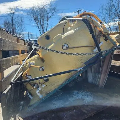 Scrap metal and an old mixer loaded for bulk metal pickup