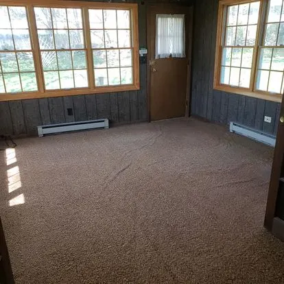 Empty sunroom after furniture and appliance removal